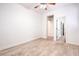 Spacious bedroom with wood flooring and an open doorway to another room at 5396 Splendido Ave, Pahrump, NV 89061