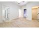 This bedroom features neutral decor and wood-look flooring for a clean and modern look at 5396 Splendido Ave, Pahrump, NV 89061