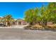 Charming single-story home featuring desert landscaping, a tile roof, and double door entry at 5396 Splendido Ave, Pahrump, NV 89061