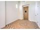 Elegant foyer with decorative tile flooring, high ceilings, and a wooden front door at 5396 Splendido Ave, Pahrump, NV 89061