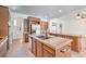 Kitchen with stainless steel appliances, custom cabinets and center island at 5396 Splendido Ave, Pahrump, NV 89061