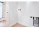 Functional laundry room features a utility sink, tile flooring, and laundry hookups at 5396 Splendido Ave, Pahrump, NV 89061