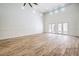Bright and spacious living room with wood floors, high ceilings, and multiple windows for natural light at 5396 Splendido Ave, Pahrump, NV 89061