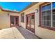 Cozy outdoor patio area with tiled flooring, stucco walls, and a view of the blue sky at 5396 Splendido Ave, Pahrump, NV 89061