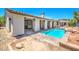Backyard includes a pool, covered patio, and tasteful landscaping, perfect for outdoor enjoyment at 5396 Splendido Ave, Pahrump, NV 89061