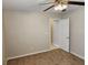 Neutral bedroom with carpet flooring, a ceiling fan and a white door at 5605 Midnight Breeze St, North Las Vegas, NV 89081