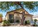 Charming one-story home featuring desert landscaping, an attached two-car garage, and stucco walls at 5605 Midnight Breeze St, North Las Vegas, NV 89081