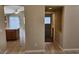 Hallway leading to the kitchen, showcasing the open-concept design and easy flow between spaces at 5605 Midnight Breeze St, North Las Vegas, NV 89081