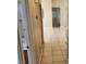 Hallway featuring tan-colored walls, tile flooring and white trim at 5605 Midnight Breeze St, North Las Vegas, NV 89081