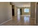 Open-concept living and dining area features tile flooring and ample natural light at 5605 Midnight Breeze St, North Las Vegas, NV 89081