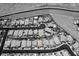 Aerial view of a residential neighborhood with a home featuring a pool and nice landscaping at 5619 Shadow Bend Dr, Las Vegas, NV 89135