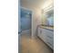 Bright bathroom featuring a granite countertop and white cabinets at 5619 Shadow Bend Dr, Las Vegas, NV 89135