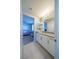 Bright bathroom featuring a granite countertop and white cabinets at 5619 Shadow Bend Dr, Las Vegas, NV 89135