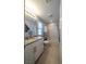 Bright bathroom featuring a granite countertop and white cabinets at 5619 Shadow Bend Dr, Las Vegas, NV 89135
