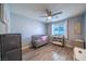 Bedroom with a crib and light blue walls, creating a calming space at 5619 Shadow Bend Dr, Las Vegas, NV 89135