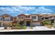 Charming two-story home with well-manicured lawn and inviting facade at 5619 Shadow Bend Dr, Las Vegas, NV 89135