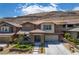 Beautiful two-story home with a landscaped front yard and mountain views at 5619 Shadow Bend Dr, Las Vegas, NV 89135