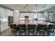 Open kitchen boasts an oversized island with barstool seating and modern appliances at 5619 Shadow Bend Dr, Las Vegas, NV 89135