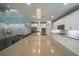 Spacious kitchen with a long island, white cabinets, and modern appliances at 5619 Shadow Bend Dr, Las Vegas, NV 89135
