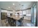 Spacious kitchen with modern white cabinetry, stainless steel appliances, and center island seating at 5619 Shadow Bend Dr, Las Vegas, NV 89135