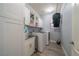 Bright laundry room features modern washer/dryer, sink, and white cabinets, offering ample storage at 5619 Shadow Bend Dr, Las Vegas, NV 89135