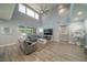 Spacious living room with high ceilings, large windows, and modern furnishings at 5619 Shadow Bend Dr, Las Vegas, NV 89135