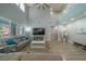 Bright living room with soaring ceilings, large windows, and cozy gray sofas at 5619 Shadow Bend Dr, Las Vegas, NV 89135