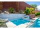 Spa with waterfall feature, and tiled planters at 5619 Shadow Bend Dr, Las Vegas, NV 89135