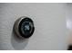 Nest thermostat mounted on the wall showing the temperature set to 76 degrees at 5619 Shadow Bend Dr, Las Vegas, NV 89135