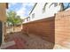 Fenced-in backyard with low-maintenance gravel and a brick paver patio at 5641 Vassar Meadow St, Las Vegas, NV 89148