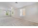 Spacious upstairs bedroom provides natural lighting and neutral carpeting at 5641 Vassar Meadow St, Las Vegas, NV 89148