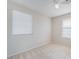 Sunlit bedroom with large windows, neutral carpet, and a ceiling fan at 5641 Vassar Meadow St, Las Vegas, NV 89148