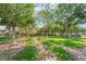 A grassy park-like setting with walking paths and mature shade trees at 5641 Vassar Meadow St, Las Vegas, NV 89148