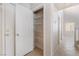 Hallway pantry with white wire shelving for ample storage space at 5641 Vassar Meadow St, Las Vegas, NV 89148