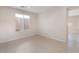 This room features tile floors, a window, and a neutral color palette at 5641 Vassar Meadow St, Las Vegas, NV 89148