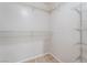 Walk-in closet equipped with white wire shelving and neutral carpet at 5641 Vassar Meadow St, Las Vegas, NV 89148