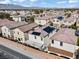 An aerial view showing solar panels on the roof of homes in a residential area at 5667 Foxglove Field St, Las Vegas, NV 89130