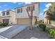 Charming two-story home featuring a two-car garage and low-maintenance front yard landscaping at 5667 Foxglove Field St, Las Vegas, NV 89130