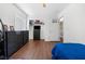 Bedroom featuring hard wood flooring, white walls, and a desk with basketball hoop decoration above it at 5967 Aimless St, Henderson, NV 89011