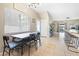 Bright dining area features tile flooring, a large window, and seamless access to the outdoor space at 5967 Aimless St, Henderson, NV 89011