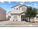 Charming two-story home with neutral stucco, manicured landscaping, and covered front porch at 5967 Aimless St, Henderson, NV 89011