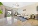 This open-concept living space features tile flooring, a casual living area, and seamless outdoor access at 5967 Aimless St, Henderson, NV 89011