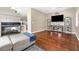 An airy living room boasts a modern fireplace and seamlessly connects to a stylish bar area at 5967 Aimless St, Henderson, NV 89011