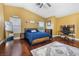 Spacious main bedroom features wood floors, ceiling fan, and a dedicated workspace at 5967 Aimless St, Henderson, NV 89011