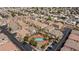 A residential neighborhood featuring various home styles, a community pool, and convenient parking at 6170 E Sahara Ave # 1076, Las Vegas, NV 89142
