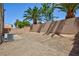 An enclosed backyard with a block wall and a patch of desert landscaping at 6170 E Sahara Ave # 1076, Las Vegas, NV 89142