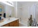 Bright bathroom with a tub-shower combo and a vanity with a white countertop and sink at 6170 E Sahara Ave # 1076, Las Vegas, NV 89142