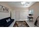 Bedroom featuring neutral walls, a ceiling fan, a futon, and a dedicated desk area at 6170 E Sahara Ave # 1076, Las Vegas, NV 89142