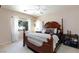 Relaxing bedroom with a four-poster bed, large window, and soft, neutral color palette at 6170 E Sahara Ave # 1076, Las Vegas, NV 89142