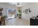 Cozy dining area with tile flooring, sliding glass doors to the backyard, and decorative shelving at 6170 E Sahara Ave # 1076, Las Vegas, NV 89142